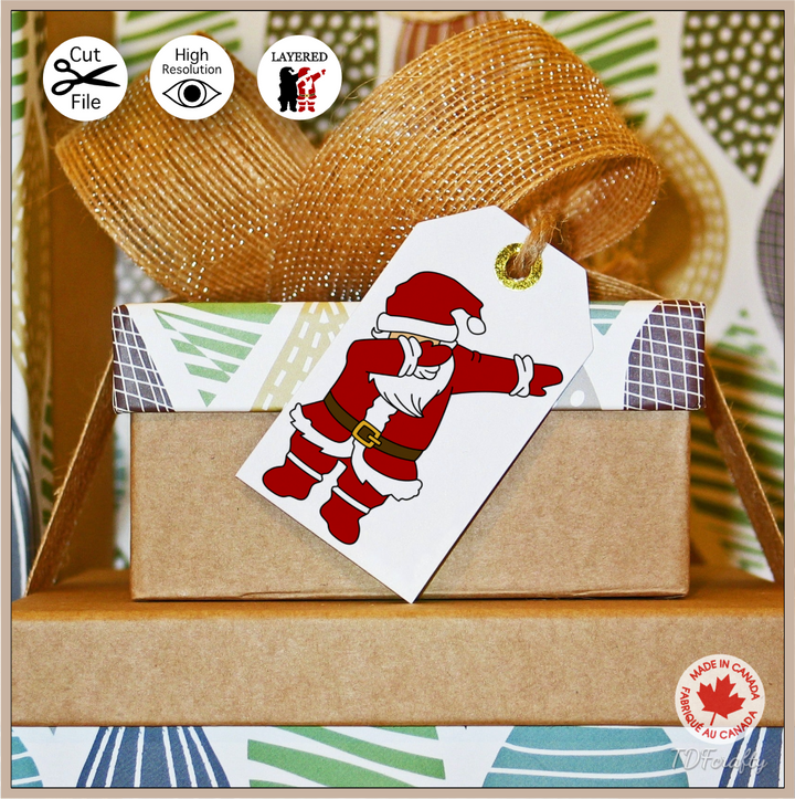 Dabbing Santa cut file design in jpg, png, svg, eps, dxf, ai, psd, pdf shown as printable gift tag.