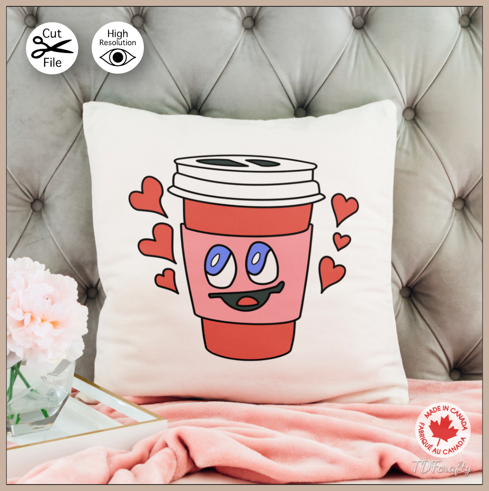 This is a digital illustration of a red to go coffee cup with a smiling face on it. It is surrounded by hearts and it looks happy. Here it is shown on a pillow.